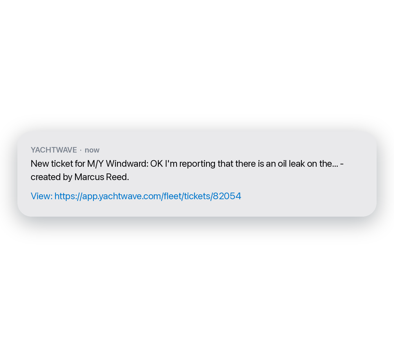 YACHTWAVE yacht management software: the same kind of alert delivered as a text message, reporting a new trouble ticket raised on a vessel
