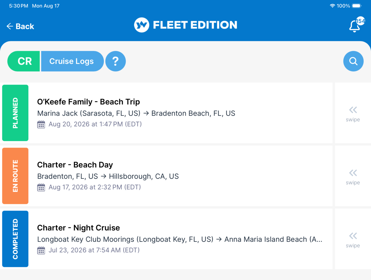 YACHTWAVE yacht management software: a vessel's cruise logs listed together &mdash; a planned family beach trip, a charter under way marked En Route, and a completed night charter, each showing its route and departure time