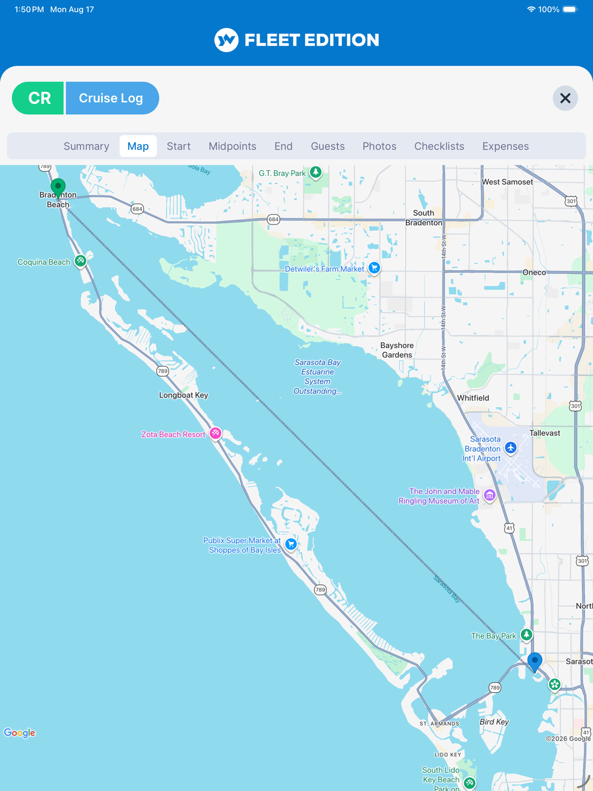 YACHTWAVE yacht management software: the same voyage on a tablet, the route drawn across Sarasota Bay, with the departure, midpoints, arrival, photos, checklists and expenses all held on the same voyage record