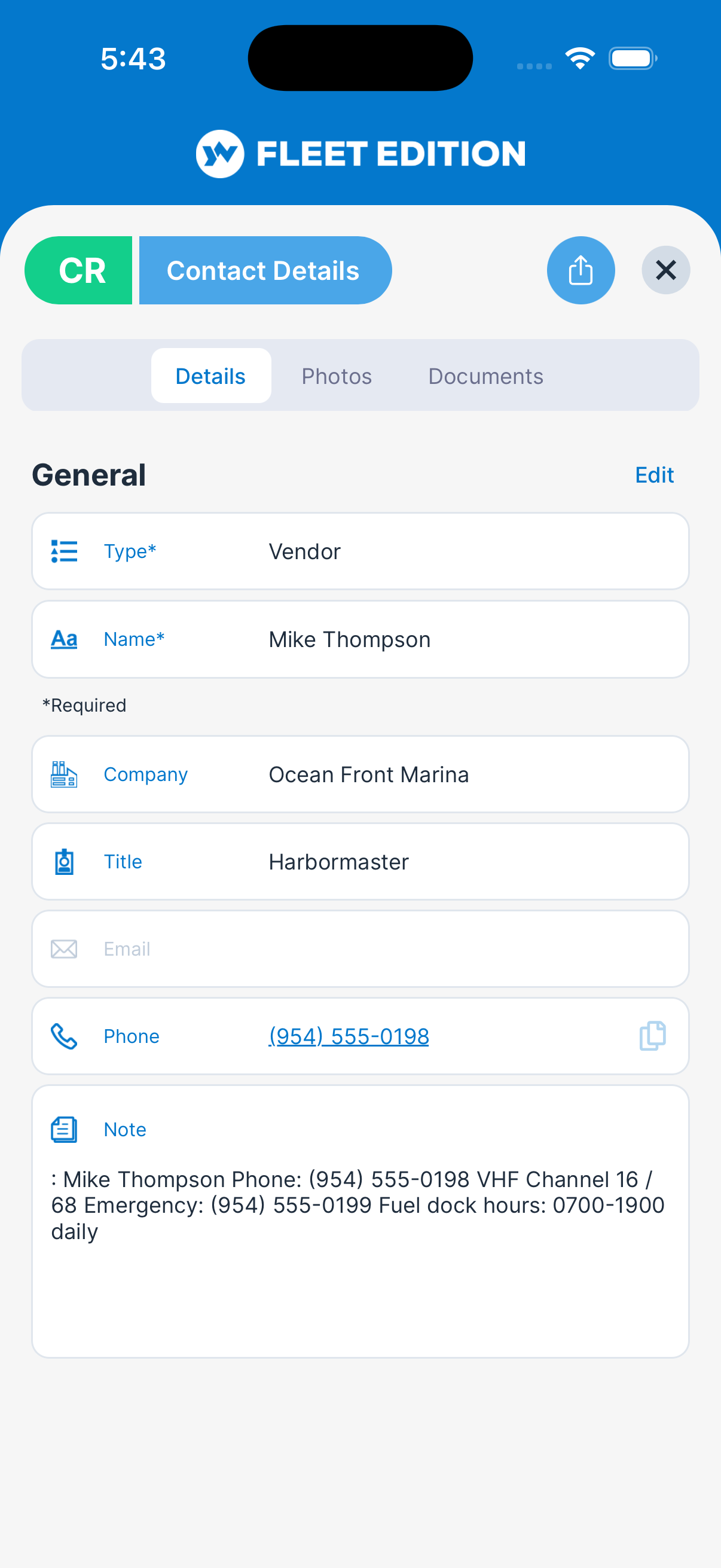YACHTWAVE yacht management software: a contact's record — the marina's harbormaster with a tap-to-call phone number, a note holding VHF channels and fuel dock hours, and Photos and Documents tabs