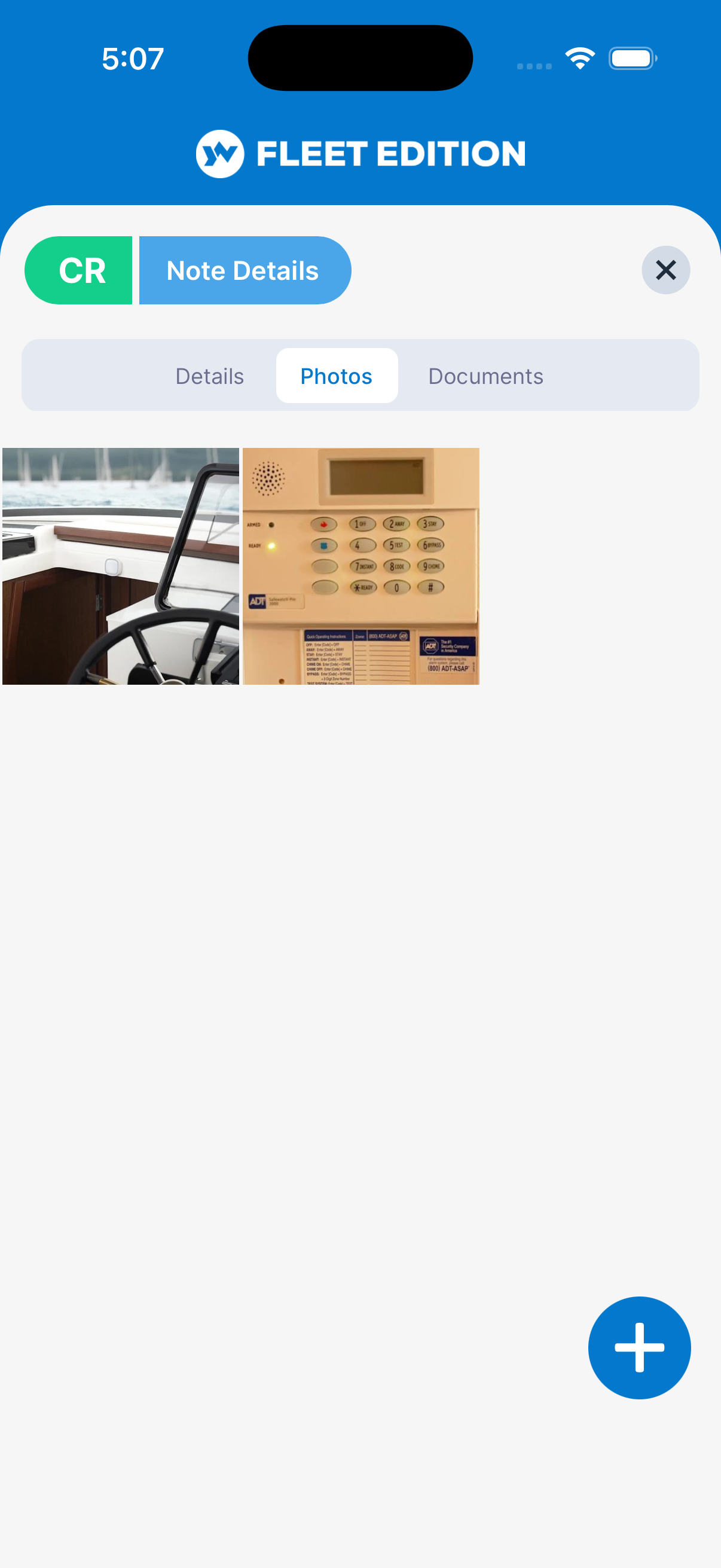 YACHTWAVE yacht management software: the Photos tab of the same note, with pictures of the helm and the alarm keypad attached