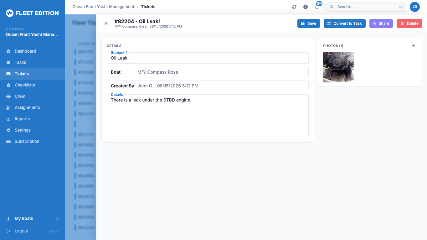 YACHTWAVE yacht management software: an open trouble ticket about an oil leak with its photo attached, and Convert to Task and Share actions in the header