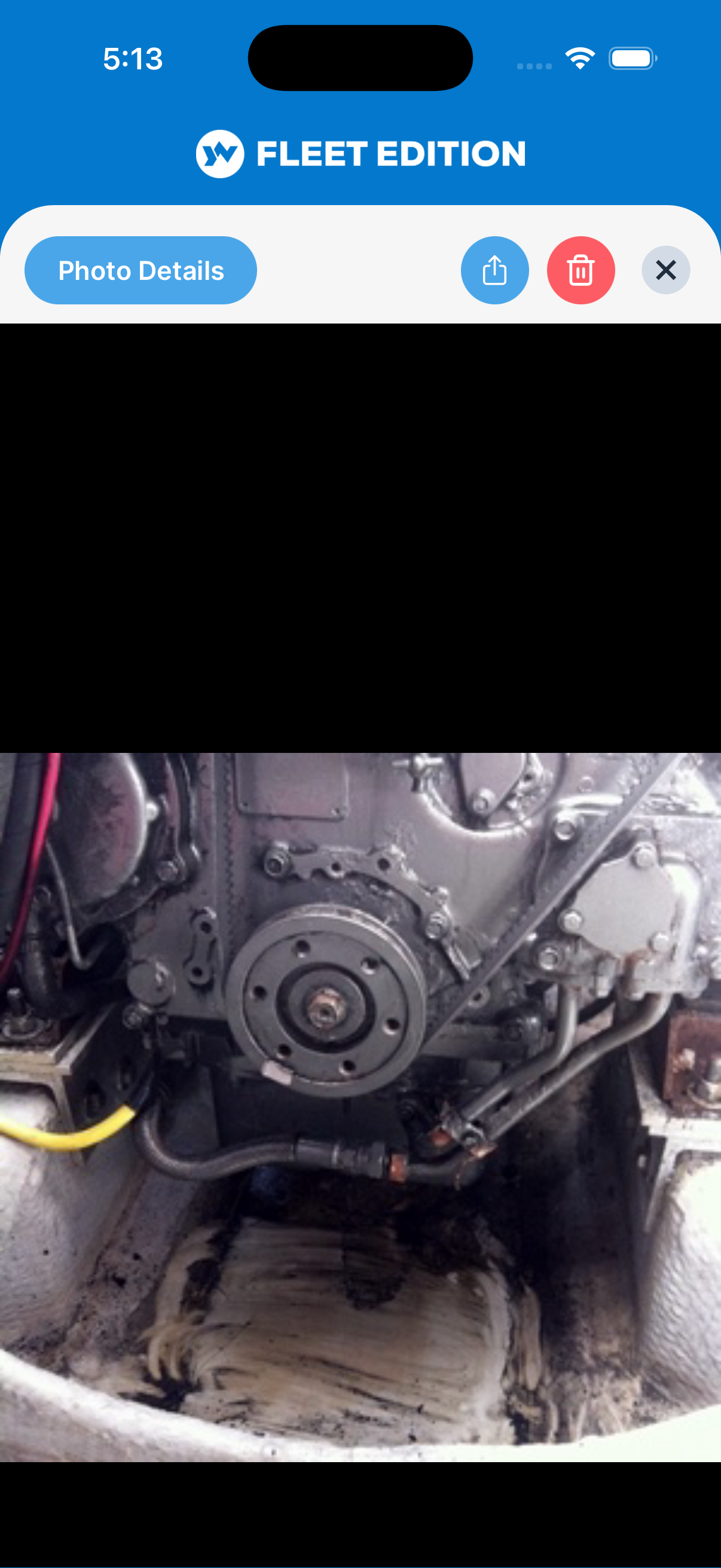 YACHTWAVE yacht management software: a photo attached to a trouble ticket, showing oil pooled in the bilge under a starboard engine